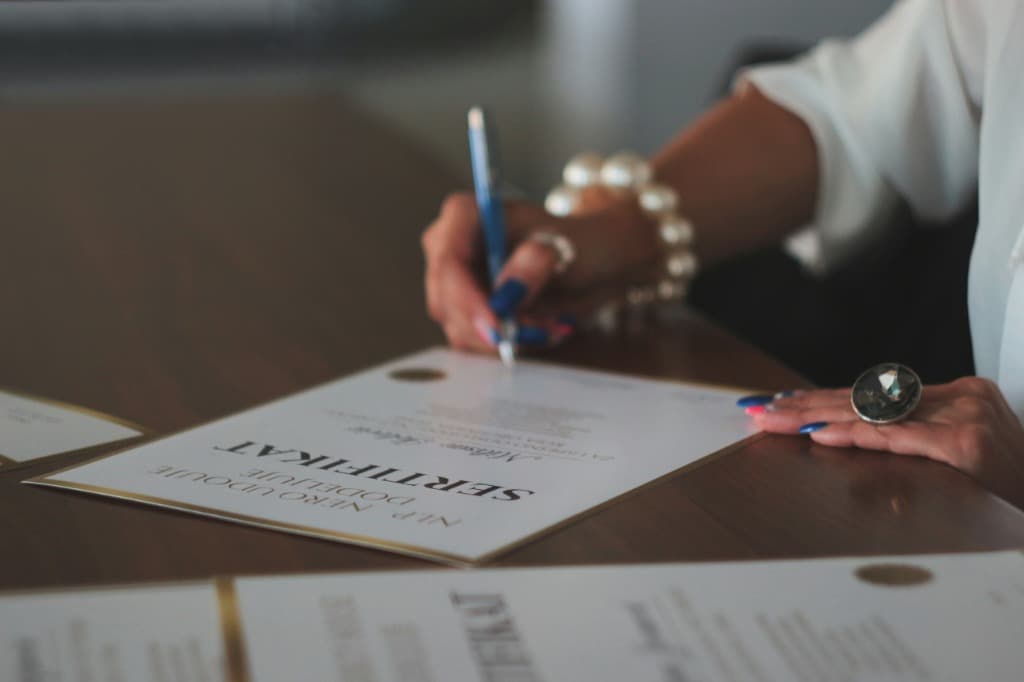 Corporate business license and statutory ISO compliance certification signing